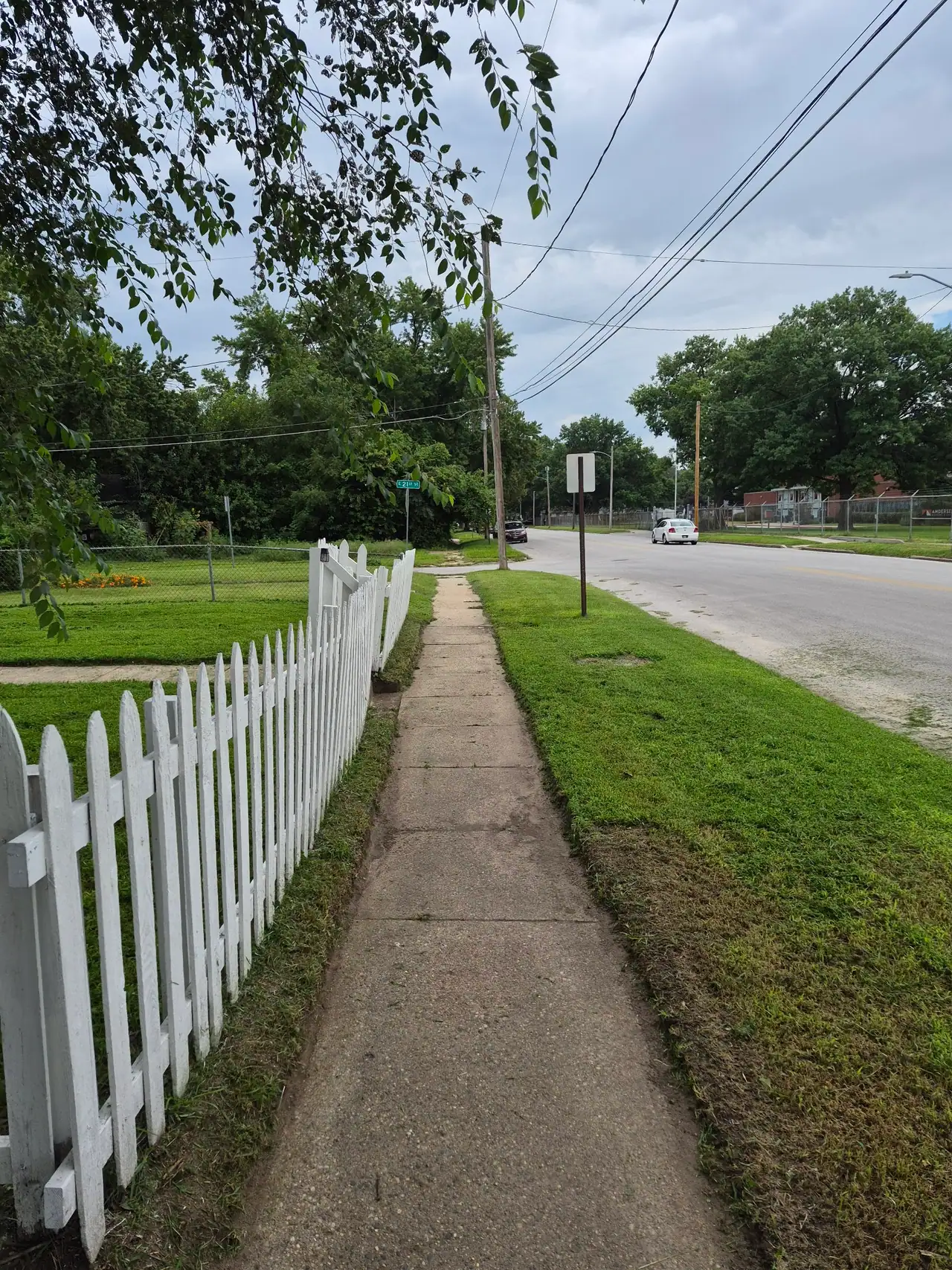 Crisp mown edge along a sidewalk in front of a Des Moines home